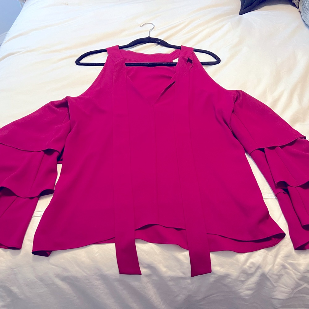 1 State Magenta Long sleeve shirt with ruffles and cut out shoulders.